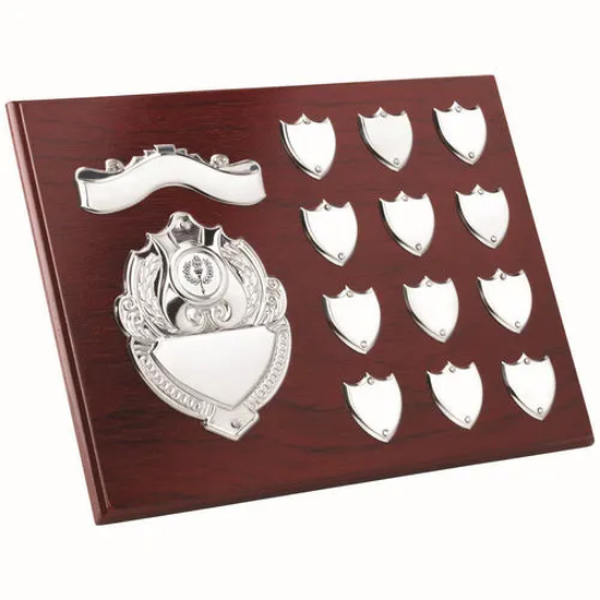 ROSEWOOD PLAQUE WITH CHROME FRONTS AND 12 RECORD SHIELDS (1in CEN) - 9 x 12in